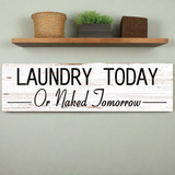 Laundry Today or Naked Tomorrow sign on wall